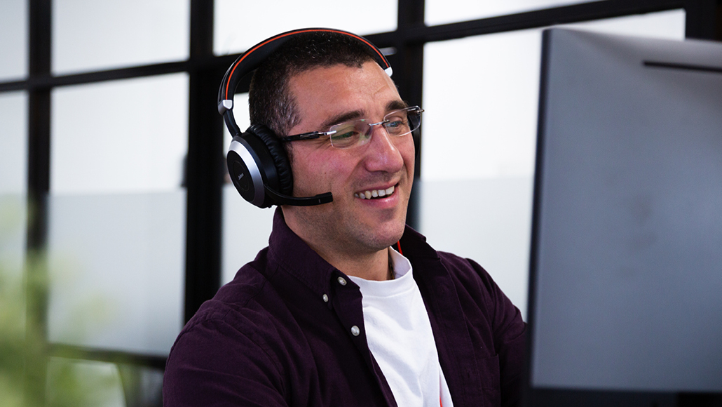 Colleague with Headset using a Computer