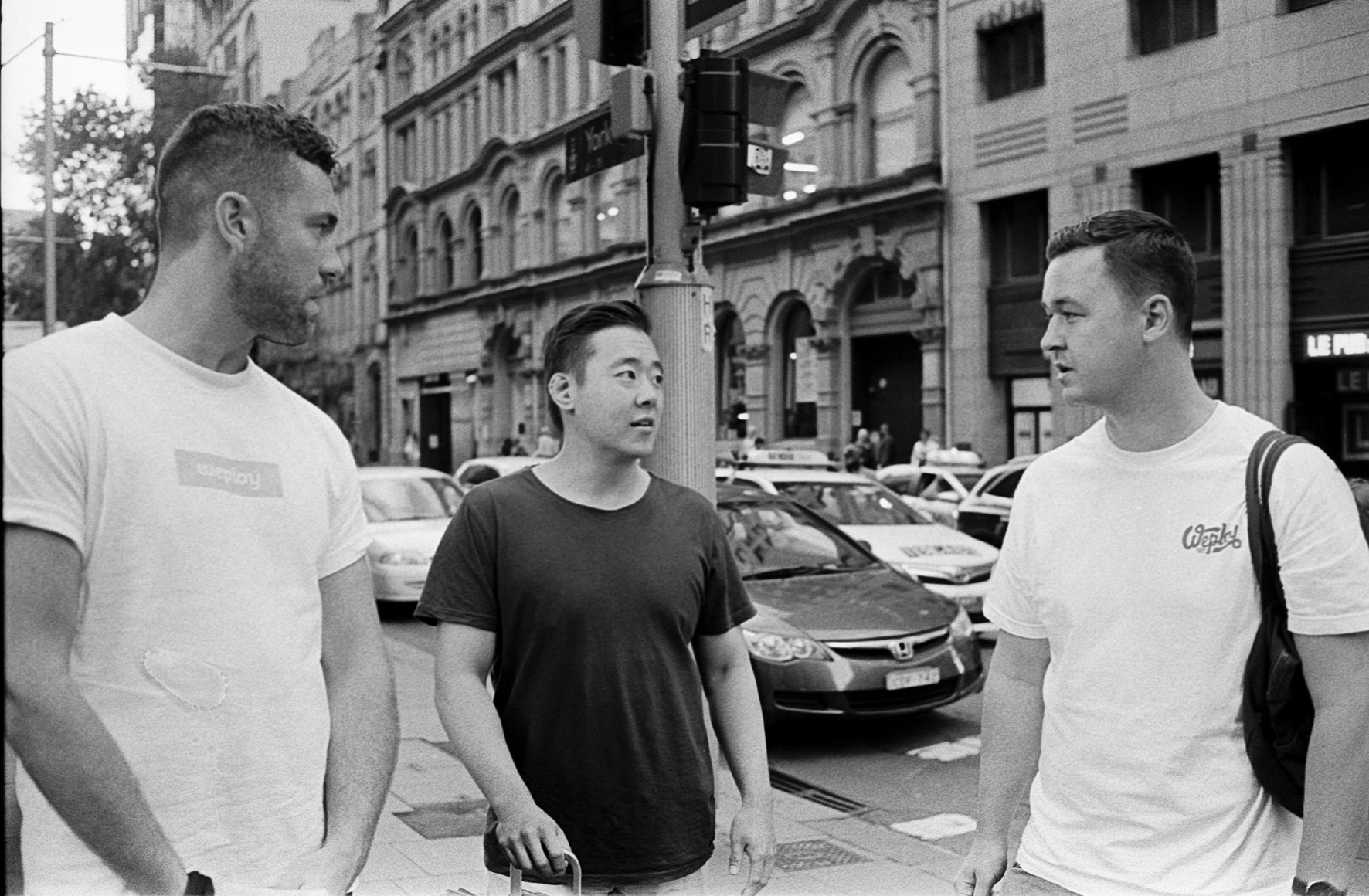 A candid film shot of our Weploy team: Tony Wu, Elliott Young and Julian Hopper in the busy streets of Sydney