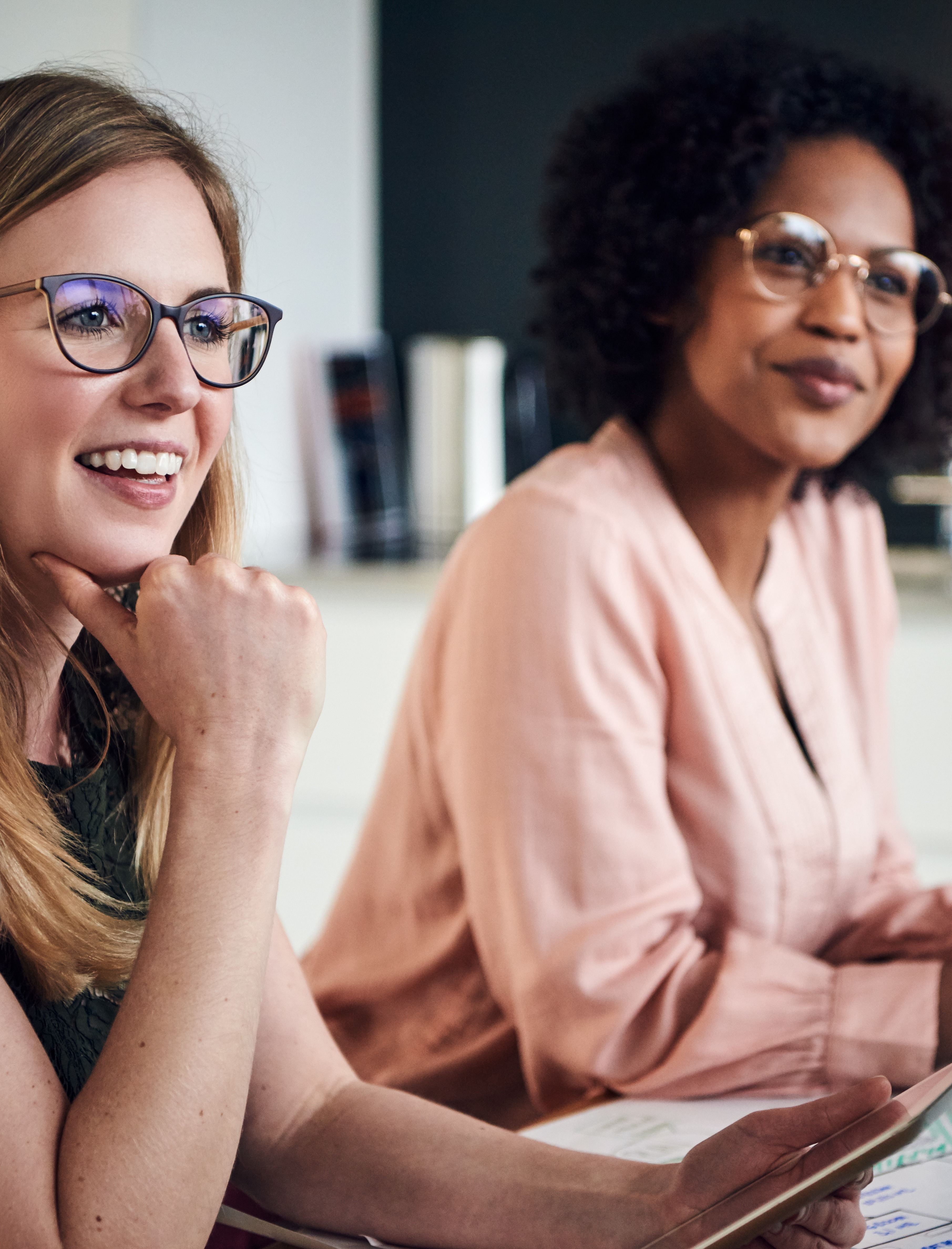 Two female colleagues brainstorming 