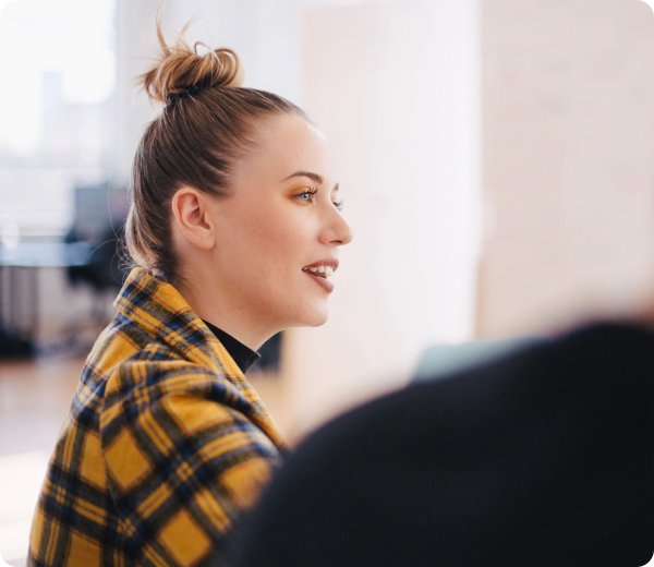 Female colleague talking in a meeting